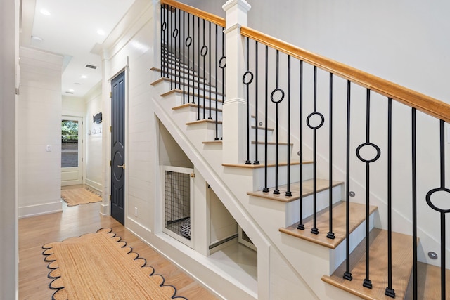 50 Camellia St, Santa Rosa Beach, FL 32459 - staircase with wood finished floors, baseboards, and ornamental molding