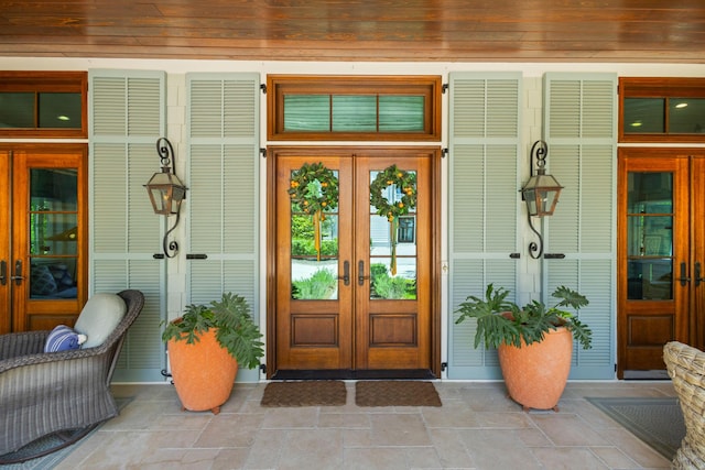50 Camellia St, Santa Rosa Beach, FL 32459 - view of exterior entry with french doors and a porch