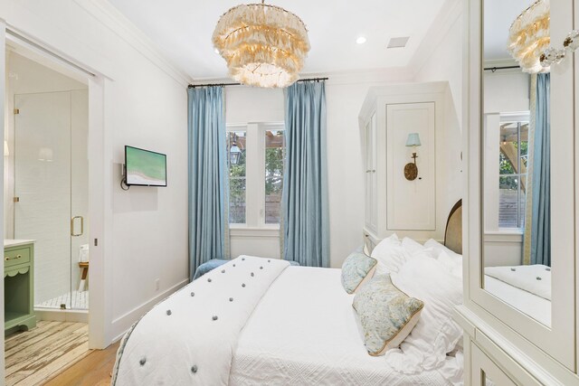 50 Camellia St, Santa Rosa Beach, FL 32459 - bedroom with a chandelier, multiple windows, ornamental molding, light wood-style floors, and ensuite bath