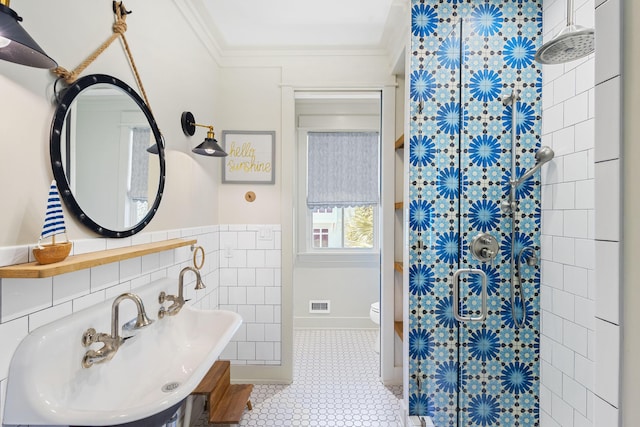 50 Camellia St, Santa Rosa Beach, FL 32459 - full bathroom featuring a sink, a shower with shower curtain, crown molding, baseboards, and tile walls