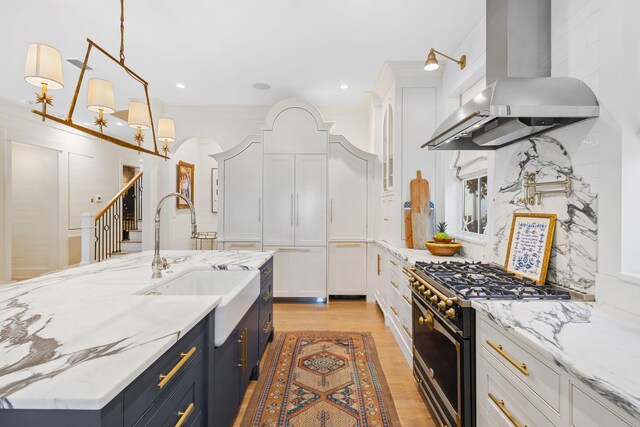 50 Camellia St, Santa Rosa Beach, FL 32459 - kitchen featuring gas range, ventilation hood, white cabinetry, a sink, and recessed lighting