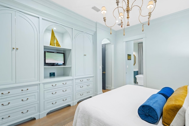 50 Camellia St, Santa Rosa Beach, FL 32459 - bedroom featuring arched walkways, crown molding, light wood-type flooring, ensuite bath, and a chandelier