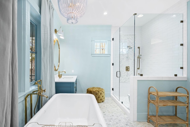 50 Camellia St, Santa Rosa Beach, FL 32459 - bathroom with a chandelier, a stall shower, a soaking tub, vanity, and recessed lighting
