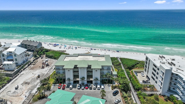 drone / aerial view of extended coastline and apartment complex