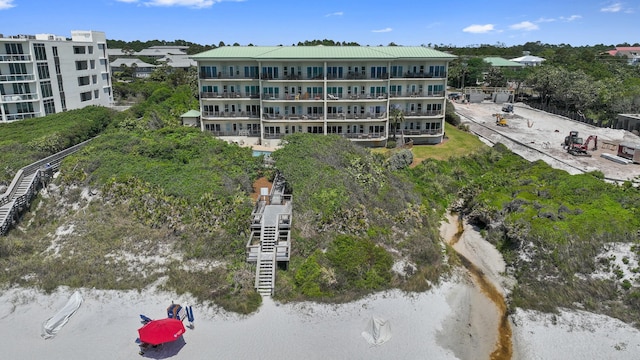 aerial view of property and surrounding area featuring a large body of water