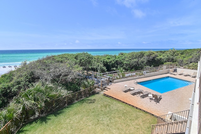 community pool featuring a water view and a patio area