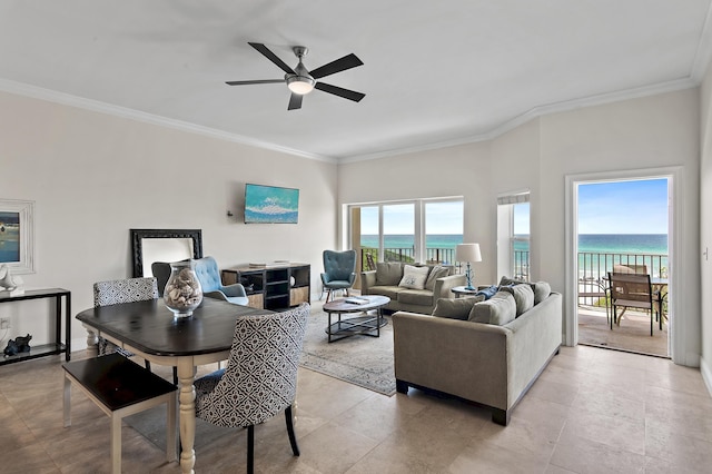 living area featuring ceiling fan and ornamental molding