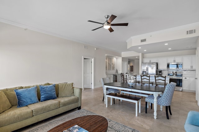 living area with ornamental molding, a ceiling fan, light tile patterned floors, and recessed lighting
