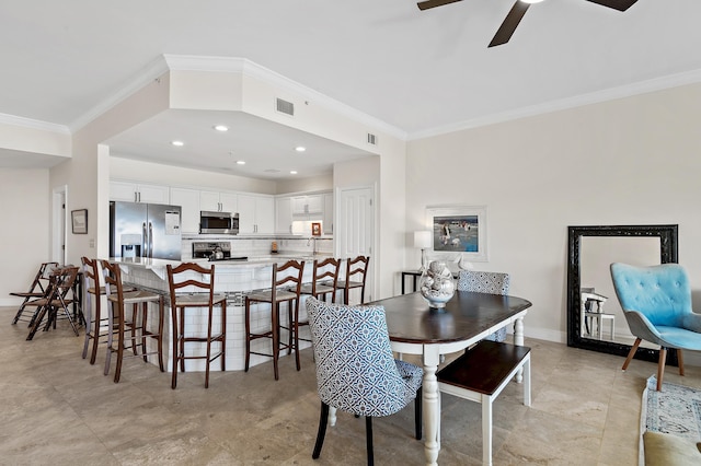 dining space with crown molding, a ceiling fan, recessed lighting, and baseboards