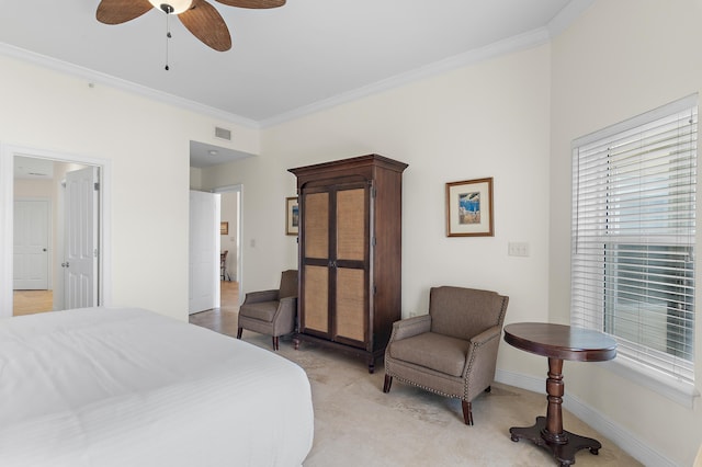bedroom with crown molding, baseboards, and a ceiling fan