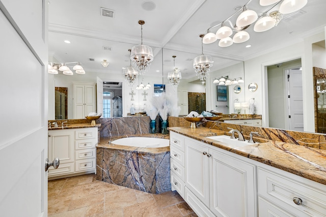 full bathroom featuring visible vents, ornamental molding, a sink, and a garden tub