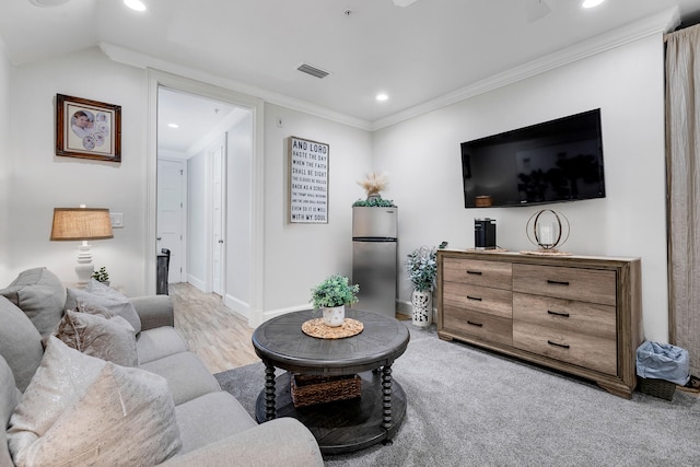 living area with recessed lighting, ornamental molding, and visible vents