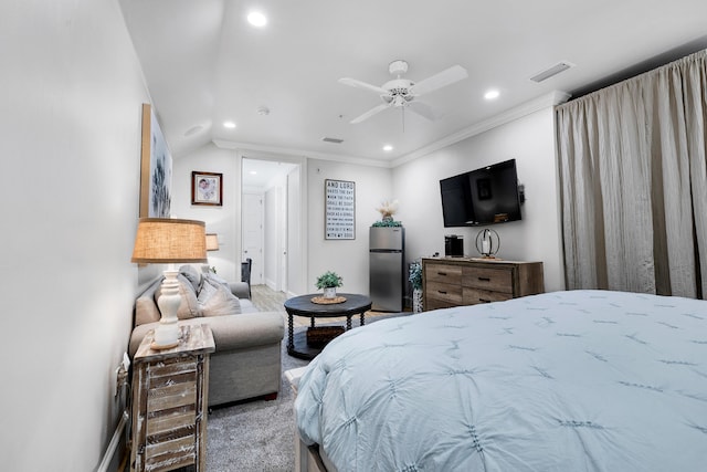 bedroom featuring freestanding refrigerator, recessed lighting, and visible vents