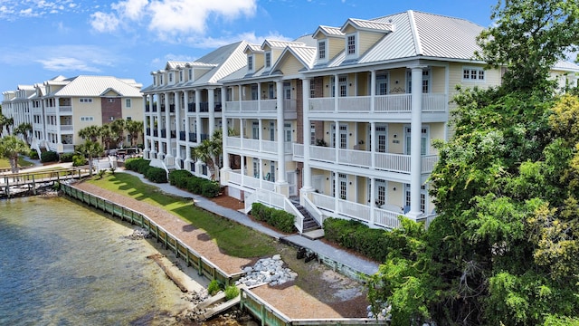 view of property with a water view and a residential view
