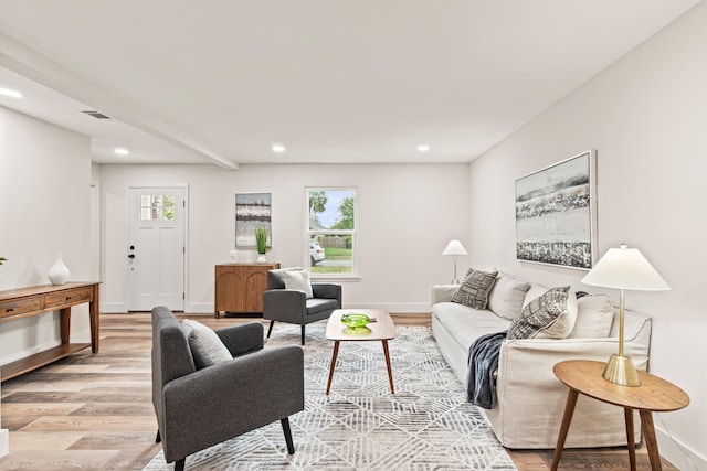 living room with recessed lighting, light wood finished floors, and a healthy amount of sunlight