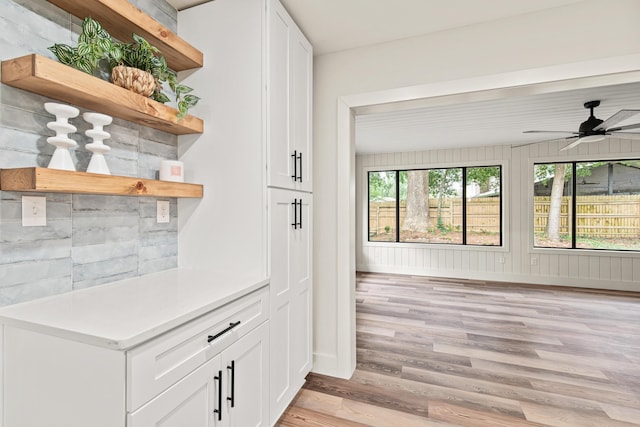 interior space with light wood-style floors and baseboards