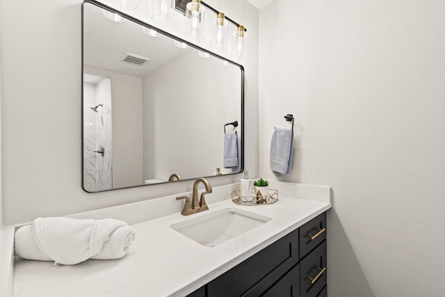 bathroom with visible vents and vanity