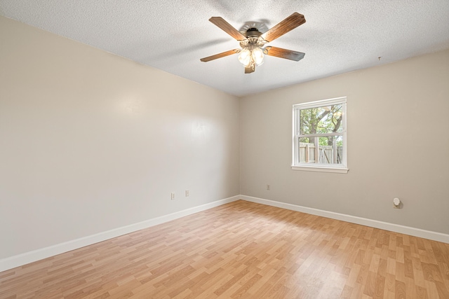 1501 Royal Palm Dr, Niceville, FL 32578 - empty room with light wood-type flooring, baseboards, a ceiling fan, and a textured ceiling