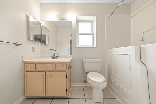 1501 Royal Palm Dr, Niceville, FL 32578 - full bathroom featuring baseboards, toilet, vanity, tile patterned floors, and a shower