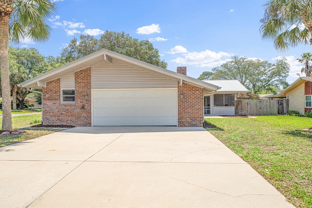 1501 Royal Palm Dr, Niceville, FL 32578 - single story home with an attached garage, brick siding, a chimney, and driveway
