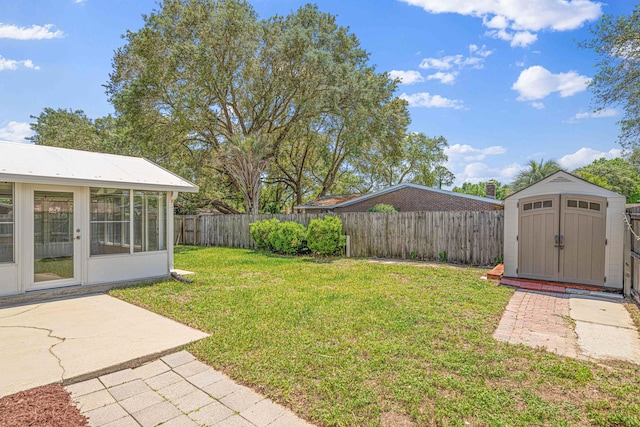 1501 Royal Palm Dr, Niceville, FL 32578 - view of yard featuring a storage unit, an outdoor structure, and a patio area