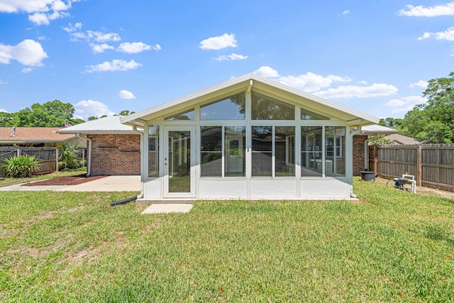 1501 Royal Palm Dr, Niceville, FL 32578 - back of house featuring a sunroom and brick siding