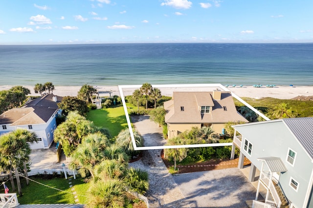 birds eye view of property featuring a water view and a view of the beach