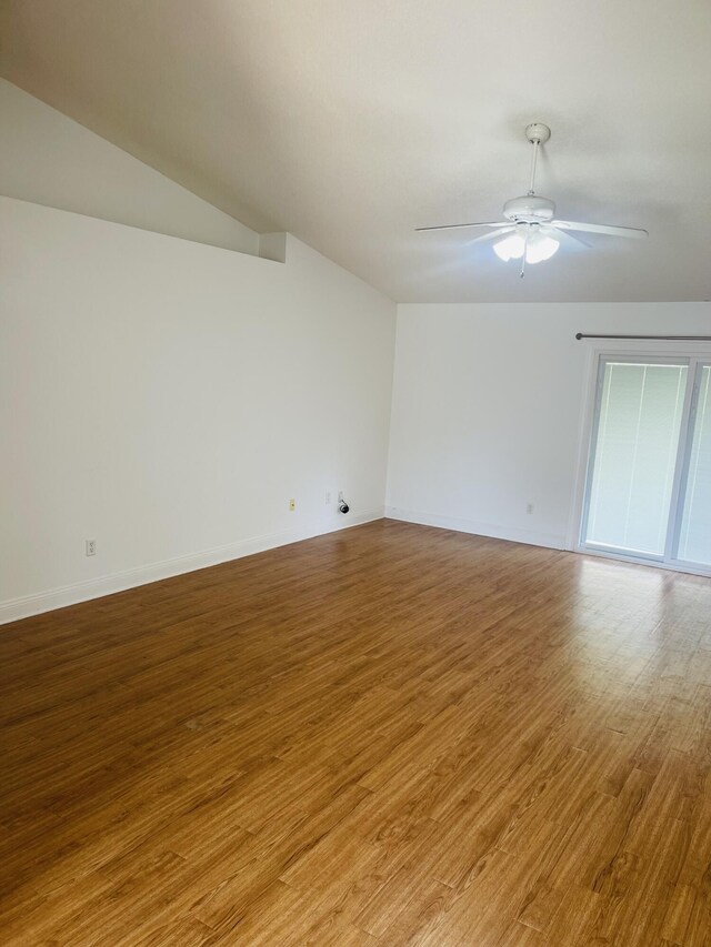 437 Hatchee Dr, Crestview, FL 32536 - unfurnished room featuring wood finished floors, ceiling fan, vaulted ceiling, and baseboards