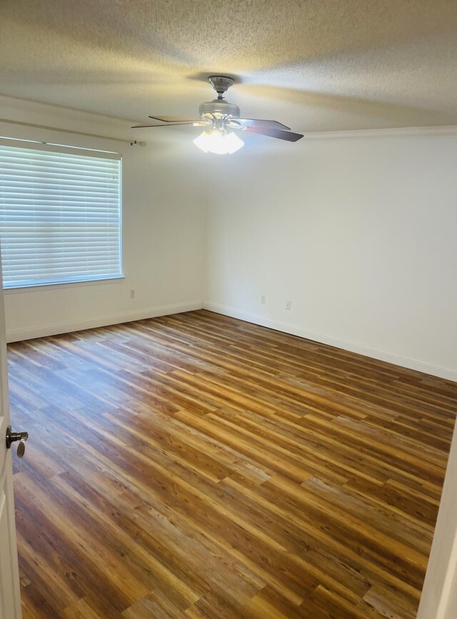 437 Hatchee Dr, Crestview, FL 32536 - unfurnished room with wood finished floors, a textured ceiling, a ceiling fan, and baseboards