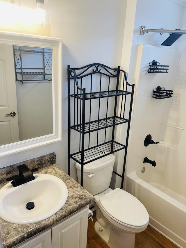 437 Hatchee Dr, Crestview, FL 32536 - bathroom with vanity, washtub / shower combination, toilet, and wood finished floors