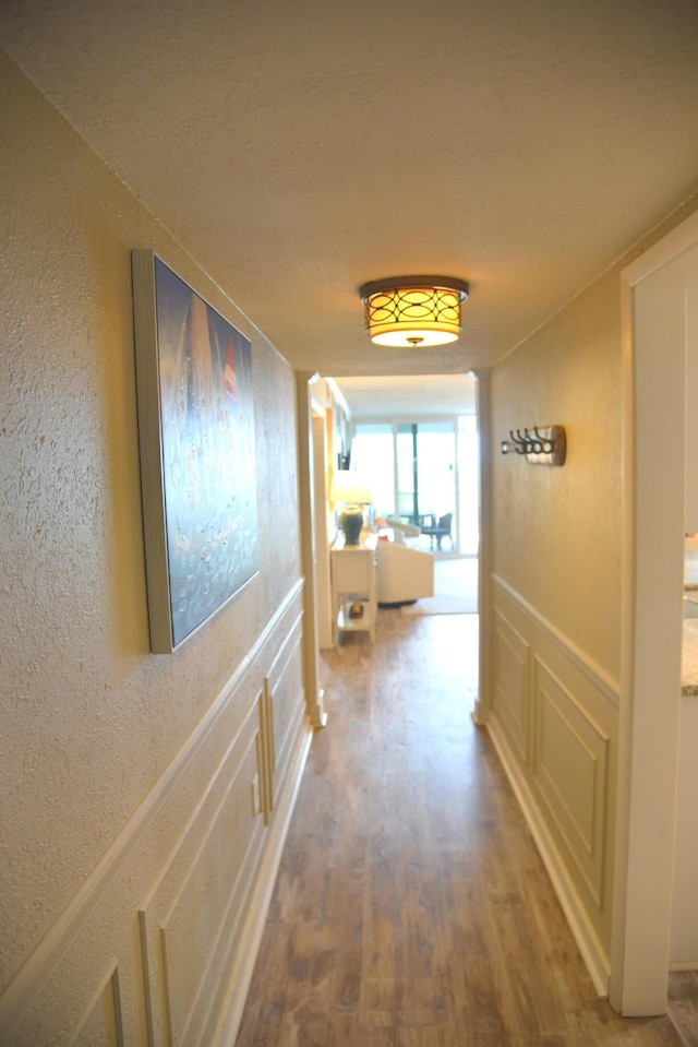 900 Gulf Shore Dr Unit 3042, Destin, FL 32541 - hall featuring a textured wall, wood finished floors, and a textured ceiling