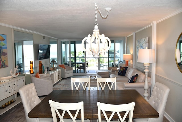 900 Gulf Shore Dr Unit 3042, Destin, FL 32541 - dining space with a chandelier, crown molding, and a textured ceiling