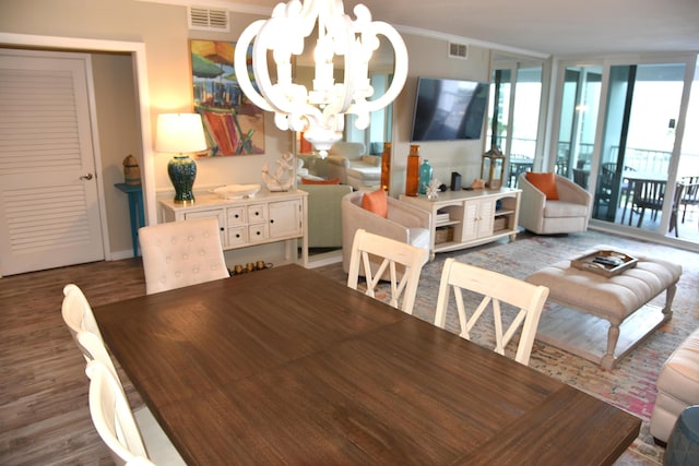 900 Gulf Shore Dr Unit 3042, Destin, FL 32541 - dining area with a chandelier, ornamental molding, and wood finished floors