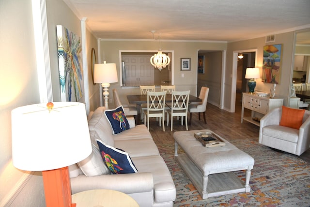 900 Gulf Shore Dr Unit 3042, Destin, FL 32541 - living room with crown molding, a chandelier, and wood finished floors