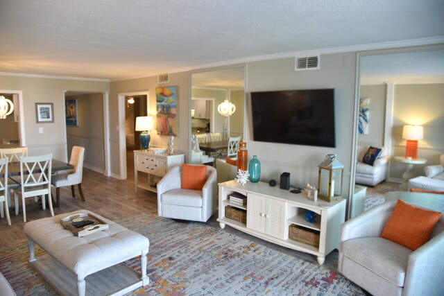 900 Gulf Shore Dr Unit 3042, Destin, FL 32541 - living area featuring crown molding, a chandelier, and wood finished floors