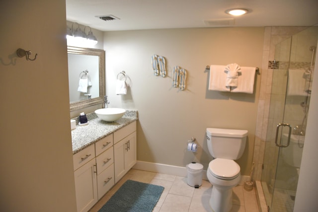 900 Gulf Shore Dr Unit 3042, Destin, FL 32541 - bathroom featuring vanity, a stall shower, toilet, tile patterned flooring, and baseboards