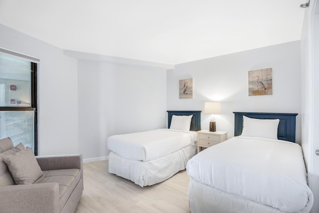 900 Gulf Shore Dr Unit 3042, Destin, FL 32541 - bedroom featuring light wood-type flooring and baseboards