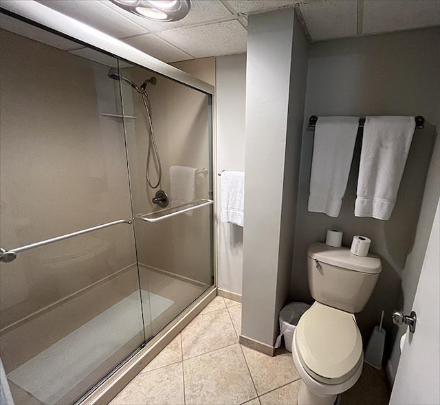 11757 Front Beach Rd Unit W600, Panama City Beach, FL 32407 - bathroom with a paneled ceiling, tile patterned flooring, a shower stall, baseboards, and toilet