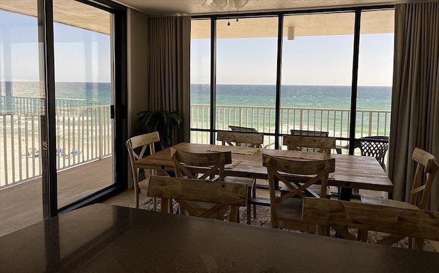 11757 Front Beach Rd Unit W600, Panama City Beach, FL 32407 - tiled dining room with a water view, a view of the beach, and expansive windows
