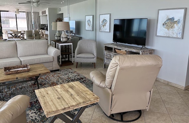 11757 Front Beach Rd Unit W600, Panama City Beach, FL 32407 - living room with baseboards, ceiling fan, and light tile patterned flooring