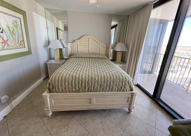 11757 Front Beach Rd Unit W600, Panama City Beach, FL 32407 - bedroom with access to outside, a textured ceiling, tile patterned floors, and multiple windows