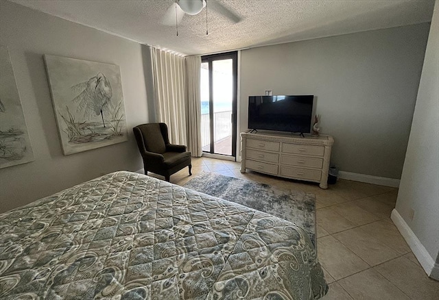 11757 Front Beach Rd Unit W600, Panama City Beach, FL 32407 - bedroom with ceiling fan, a textured ceiling, access to exterior, baseboards, and light tile patterned floors