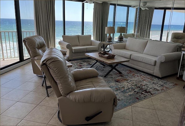 11757 Front Beach Rd Unit W600, Panama City Beach, FL 32407 - living room featuring expansive windows, a water view, and light tile patterned floors