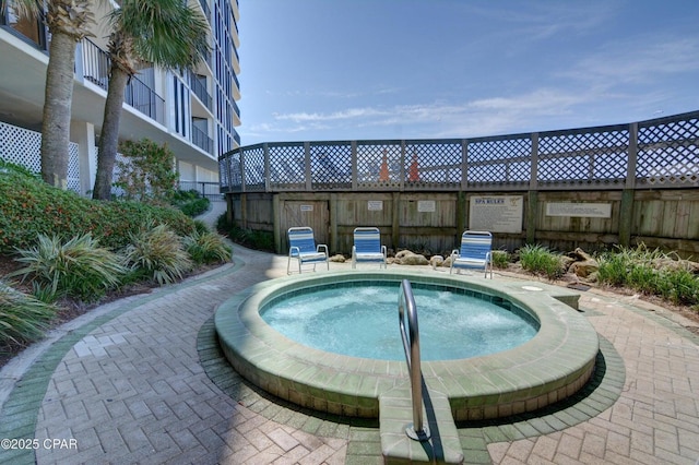 11757 Front Beach Rd Unit W600, Panama City Beach, FL 32407 - view of pool with a hot tub and fence