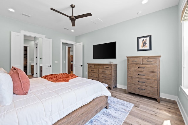 bedroom featuring a ceiling fan, visible vents, baseboards, light wood finished floors, and recessed lighting