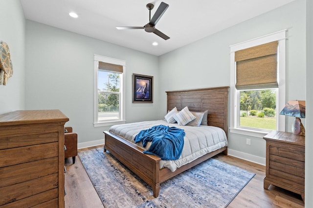 bedroom featuring recessed lighting, baseboards, ceiling fan, and wood finished floors