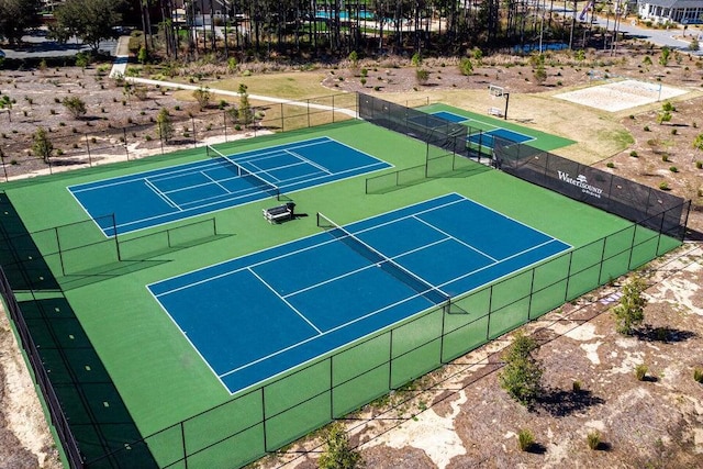 view of tennis court with fence