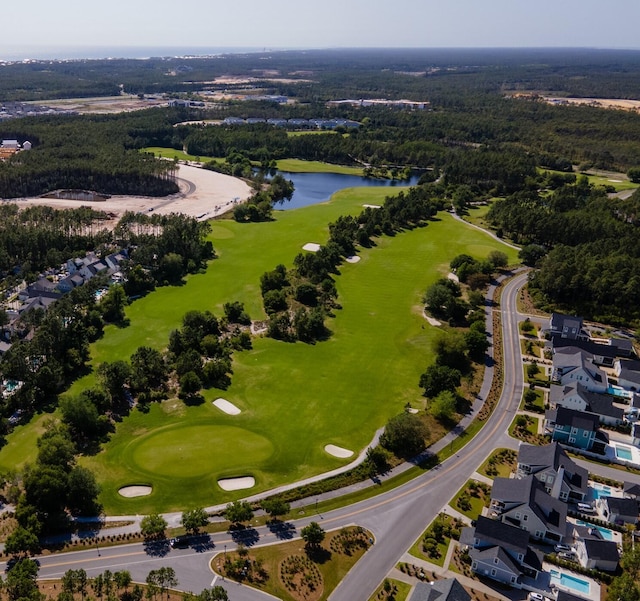 aerial view featuring a water view, a residential view, and golf course view