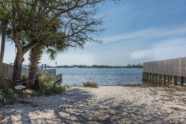 property view of water featuring fence