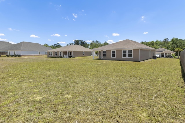 back of property with a yard